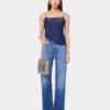 Jeans iconici con dischi metallici 1969