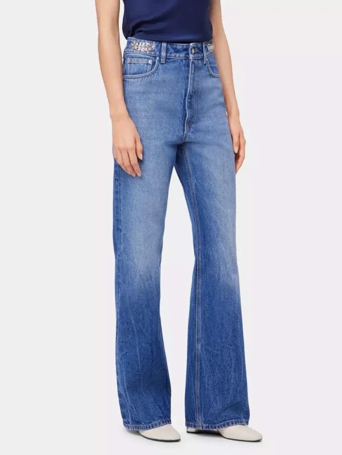 Jeans iconici con dischi metallici 1969