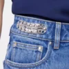 Jeans iconici con dischi metallici 1969