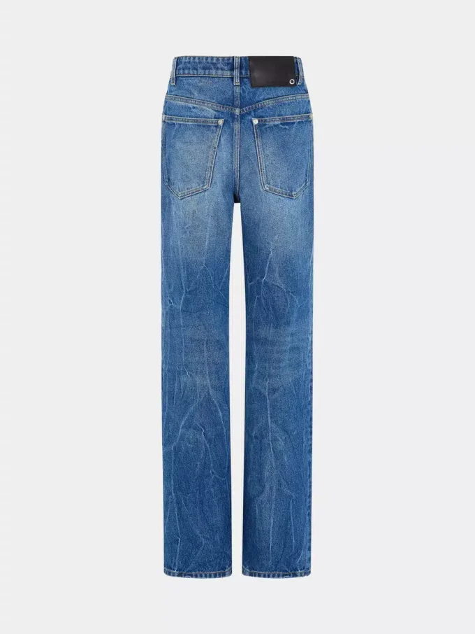 Jeans iconici con dischi metallici 1969