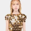 L’iconico abito dorato Sparkle Disc